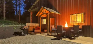 metal barn with seating area and fire pit